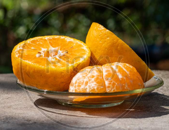 Half Cut Oranges In A Plate