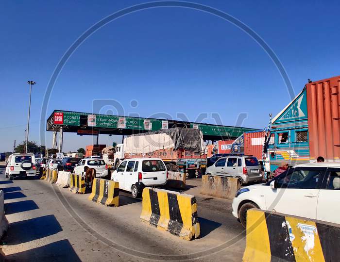 Fastag Enabled Toll Booth Plaza And Toll Gates With Traffic Lined Up In Each Gate