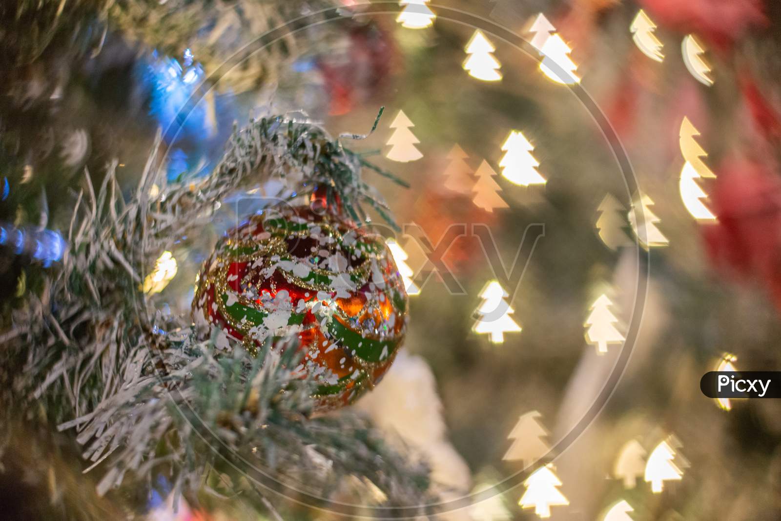 Selective Focus Christmas Ball With Snow Tree