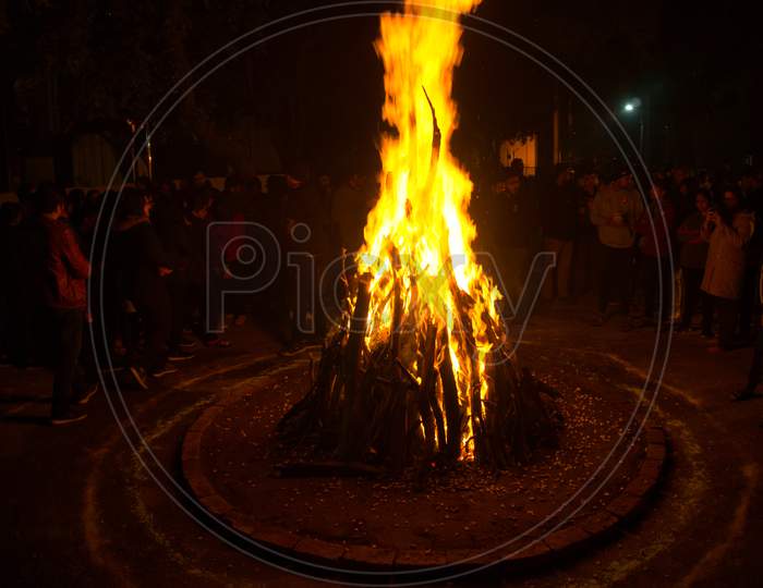 Giant Bon Fire Lit For The Festival Of Lohri Surrounded By People
