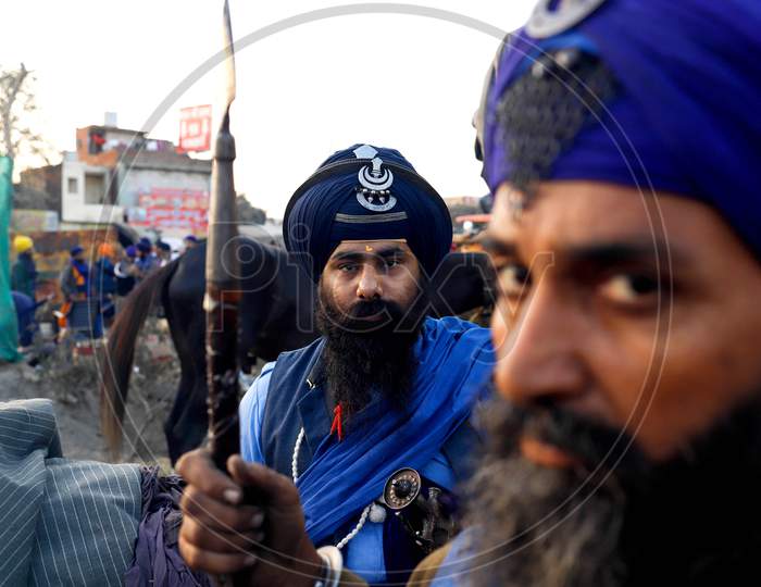 Nihang (Sikh Warrior) Poses For A Photograph Near The Road Blockade Against The Newly Passed Farm Bills At Singhu Border Near Delhi, India On December 13, 2020. Thousands Of Farmers Are Protesting On Various Borders Of The National Capital Since November 26.