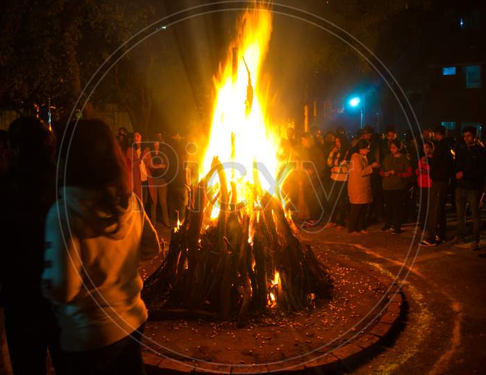 Giant Bon Fire Lit For The Festival Of Lohri Surrounded By People