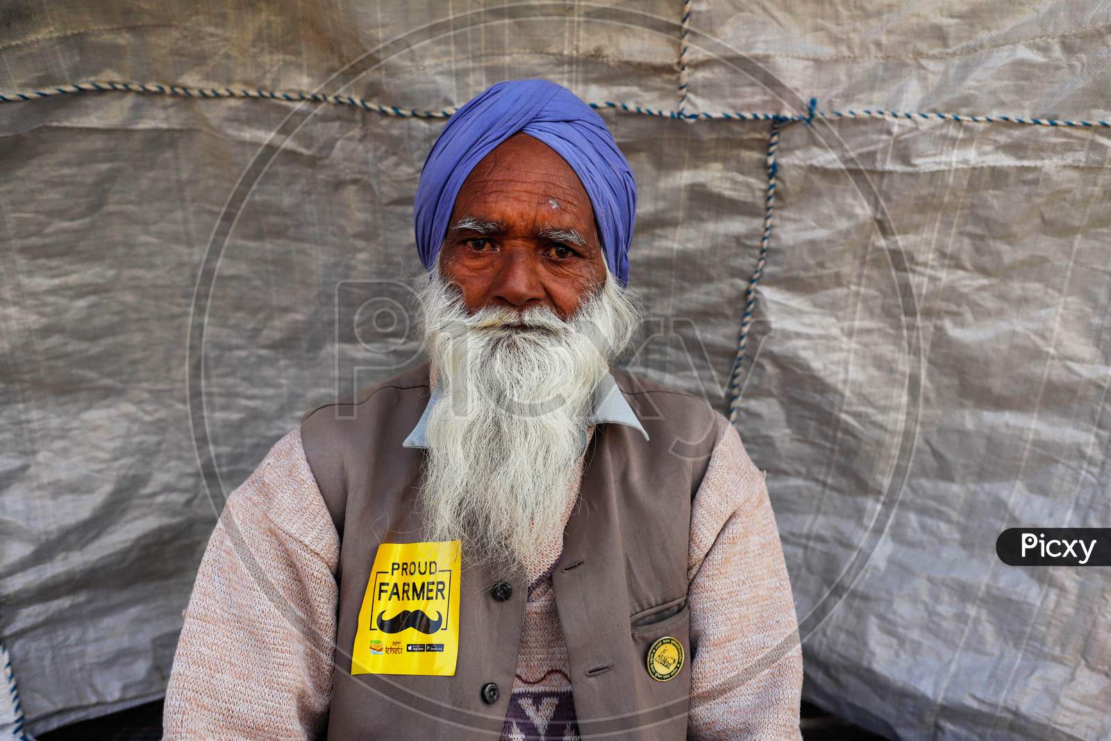 A Protesting Farmer Poses For A Photograph Near The Road Blockade Against The Newly Passed Farm Bills At Singhu Border Near Delhi, India On December 13, 2020. Thousands Of Farmers Are Protesting On Various Borders Of The National Capital Since November 26.