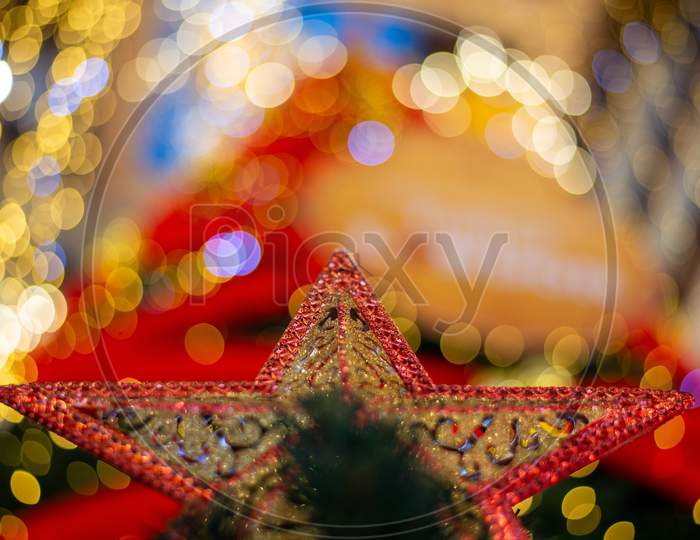 Selective Focus Star Ornament With Background Colorful Bokeh