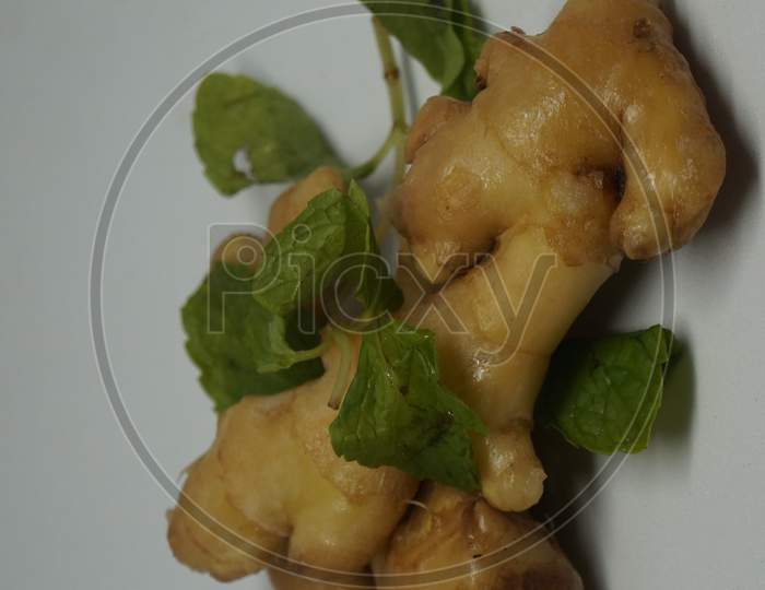 Ginger root with mint leaves.