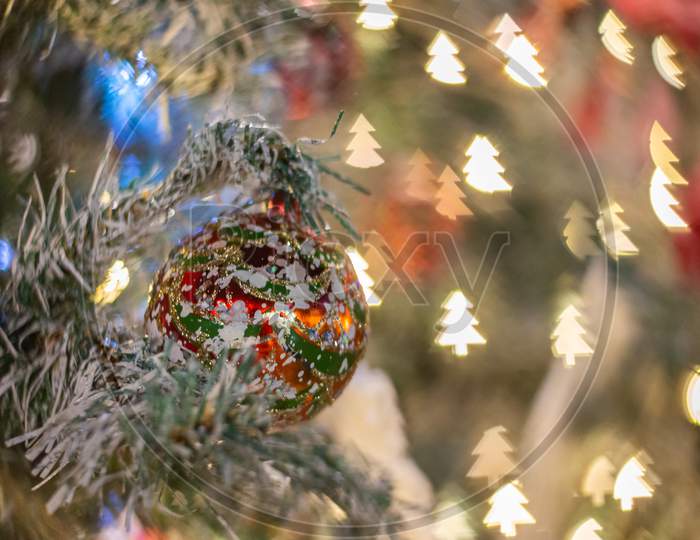 Selective Focus Christmas Ball With Snow Tree