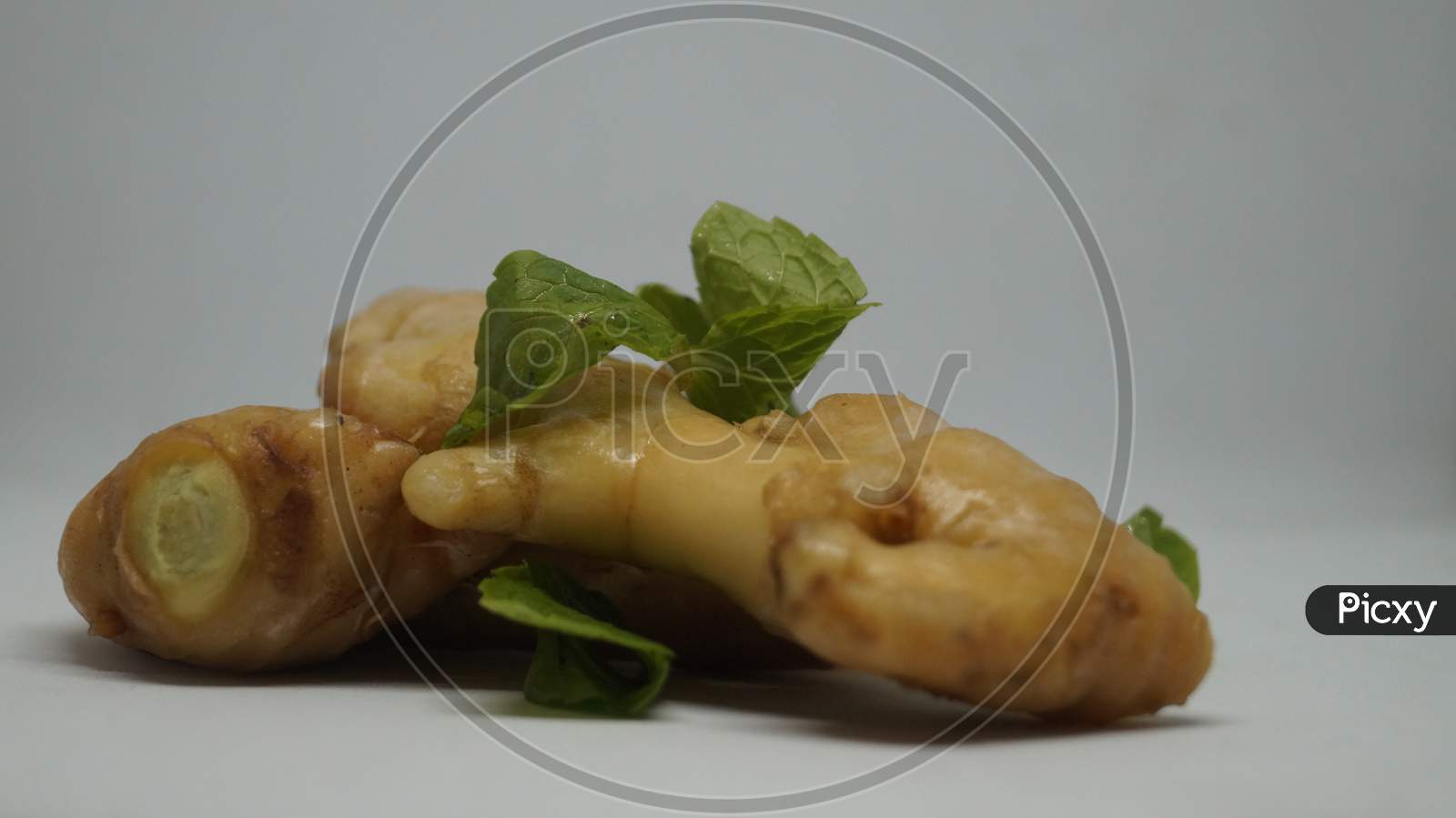 Ginger root with mint leaves.