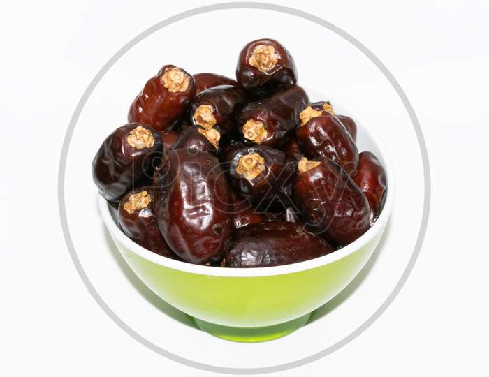 Brown color Arabian dates isolated on white background