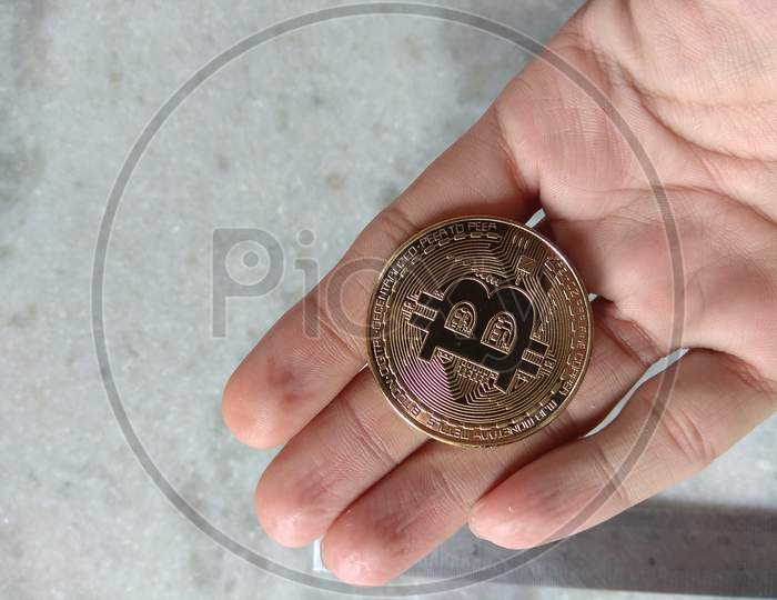 Bitcoin Litecoin Monero Physical Coins Cryptocurrency Front View in Palm Hand