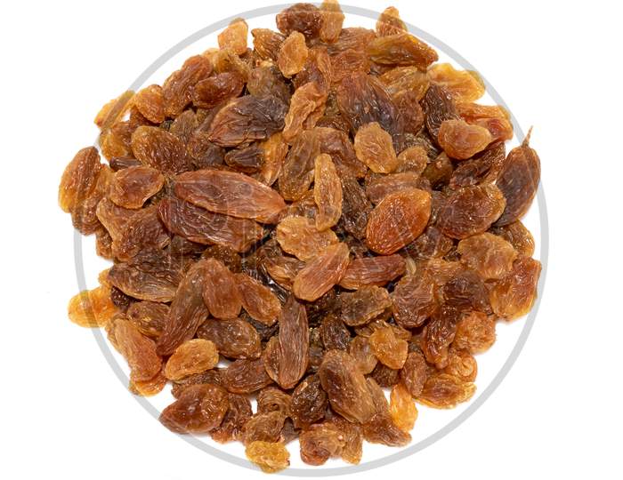 Dry fruits raisins isolated on white background with empty space for text top view