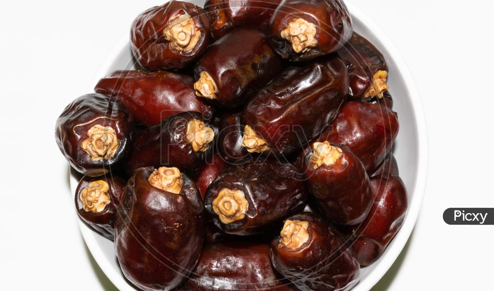 Brown color Arabian dates top view isolated on white background