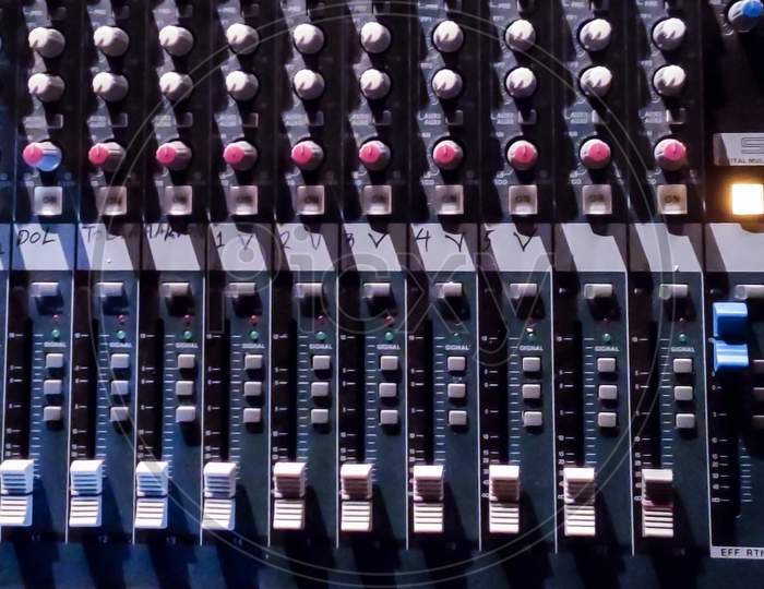 Audio Console.Amplifying Equipment That Adjusts Studio Audio Mixer Knobs And Faders. Workplace And Equipment Of The Sound Engineer. Acoustic Mixing Of Music, Selective Focus. Banner.