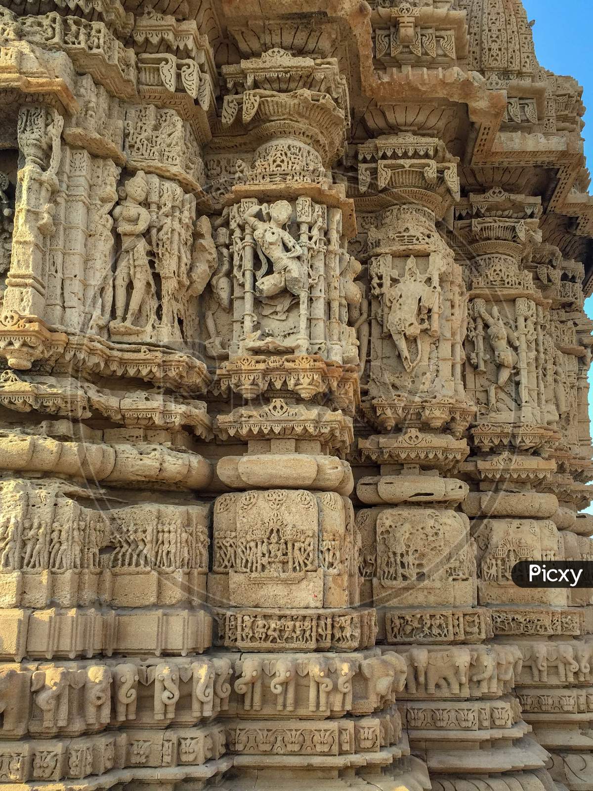 ancient hindu temple stone wall carving