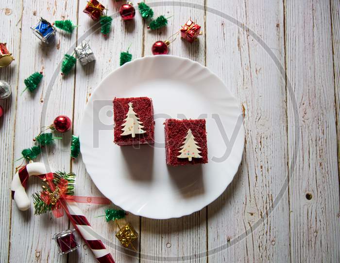 Delicious red velvet cake along with Christmas decorations