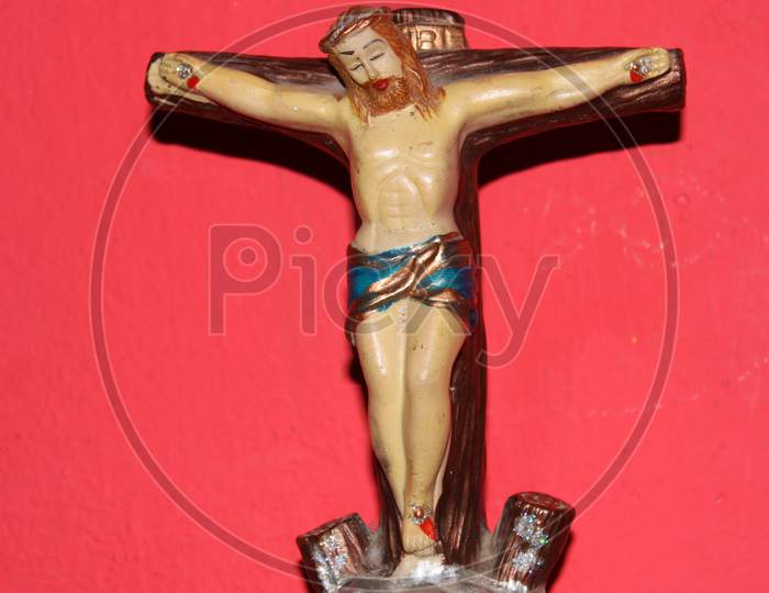 Jesus Christ Statue With Red Background.