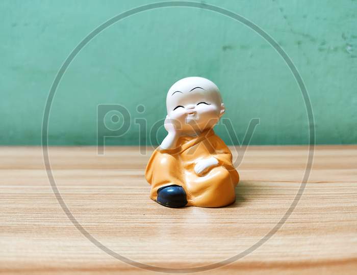 Very Cute Baby Monk Relaxing Blur Background