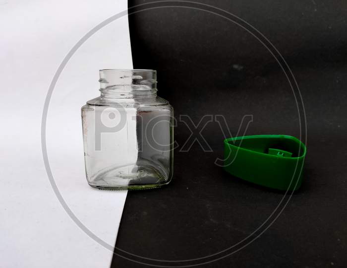 Empty Glass Jar With Green Cap. Isolated On White And Black Background.