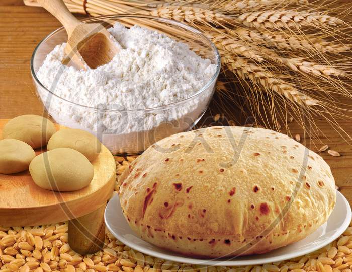 Wheat Flour, Chapati, Roti, Bunch Of Wheat Ears, Dried Grains, Flour In Terracota Bowl. Cereals Harvesting, Bakery Products.