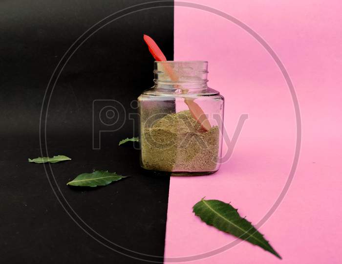 Kabasura Powder In Glass Jar With Neem Leaves Surrounded. Immunity Booster For Corona Virus Treatment.