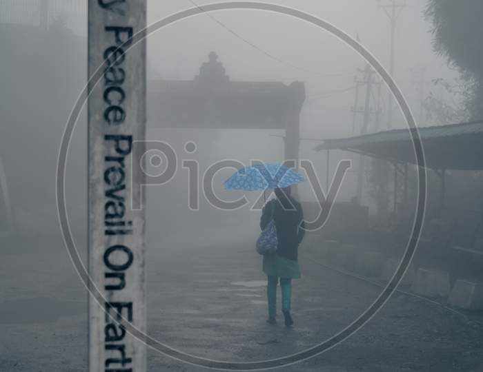 peace prevail on earth slogan on a white pillar with foggy background