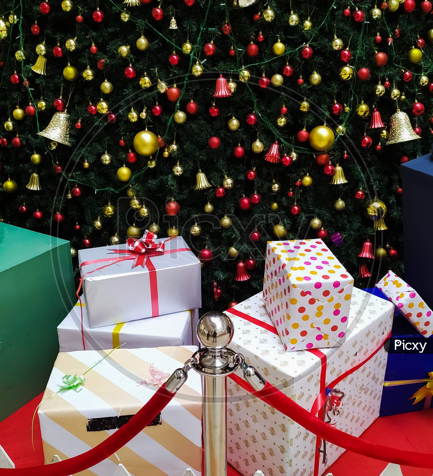 Christmas gift boxes in decorated Christmas tree background