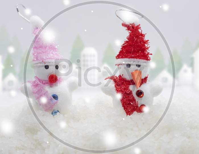 Merry Christmas And Happy New Year Greeting Card .Two Cheerful Snowman Standing In Winter Christmas Landscape.