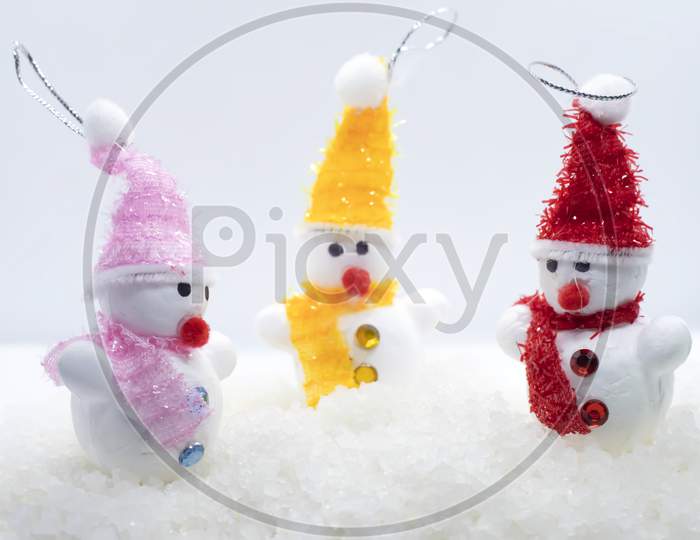 Happy Snowman Family. Snowman Family Standing In Winter Christmas Landscape. Merry Christmas And Happy New Year