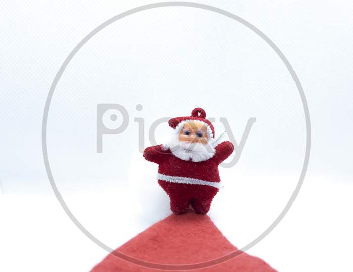Santa Claus Standing On The Red Carpet On A White Background