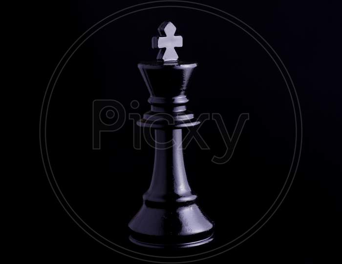 One Side Light On Black King Chess Piece In Black Background