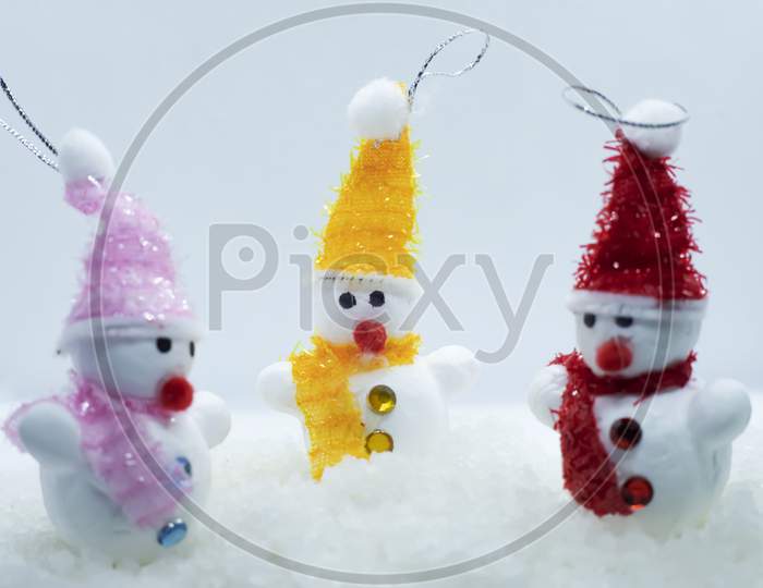 Merry Christmas And Happy New Year Greeting Card With Copy-Space.Many Snowmen Standing In Winter Christmas Landscape.Winter Background