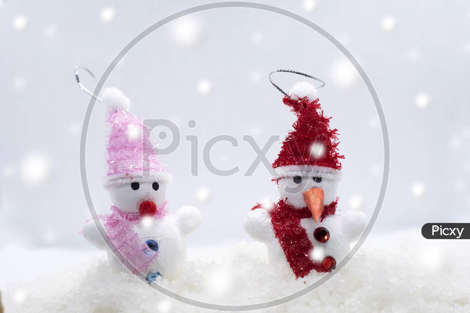 Merry Christmas And Happy New Year Greeting Card With Copy-Space.Two Snowmen Standing In Winter Christmas Landscape.Winter Background