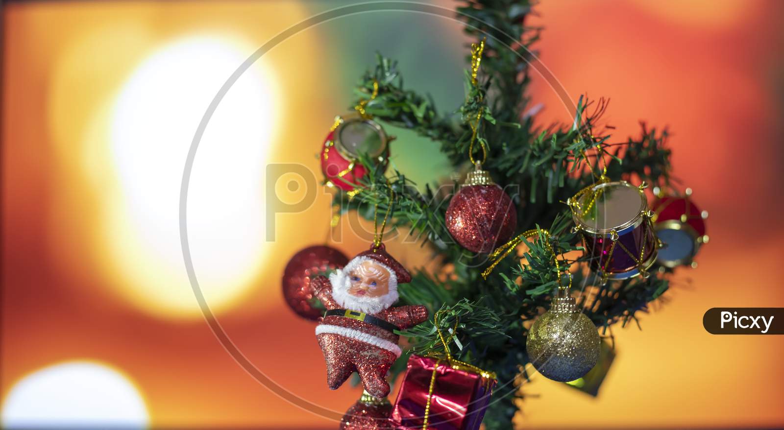 Decorated Christmas Tree On Blurred Background. Christmas Ornament Hanging On The Tree