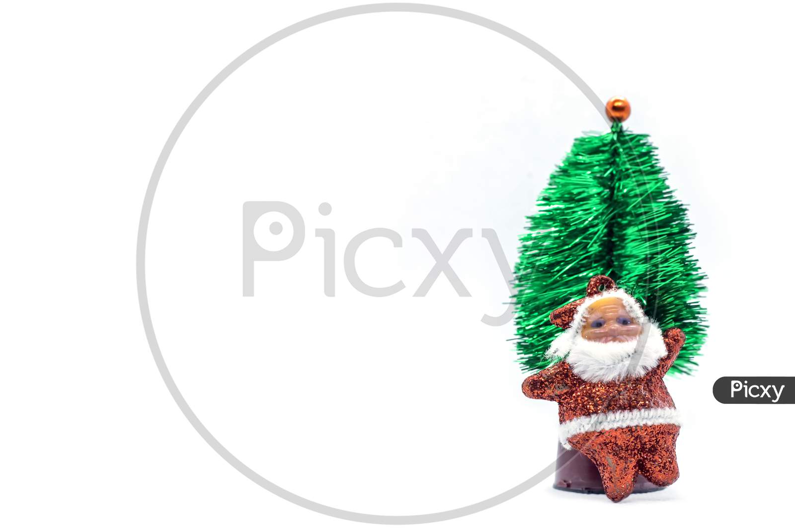 Christmas Concept. Miniature Christmas Tree With Santa Claus On White Background. 2021 New Year.