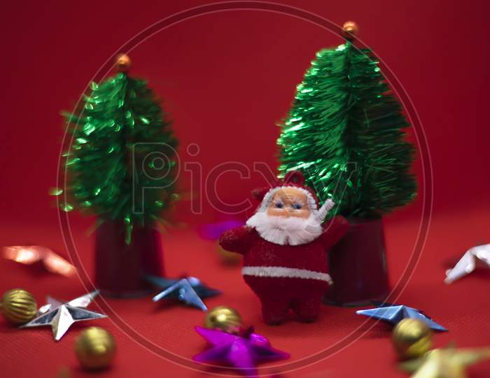 Christmas Composition. Santa Claus, Tree, Stars, Balls On Red Background. Christmas, New Year Concept. Copy Space
