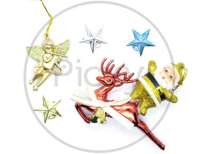 Merry Christmas: Top View Of Santa Claus On A Reindeer Traveling In The Sky With The Star And A Golden Angel