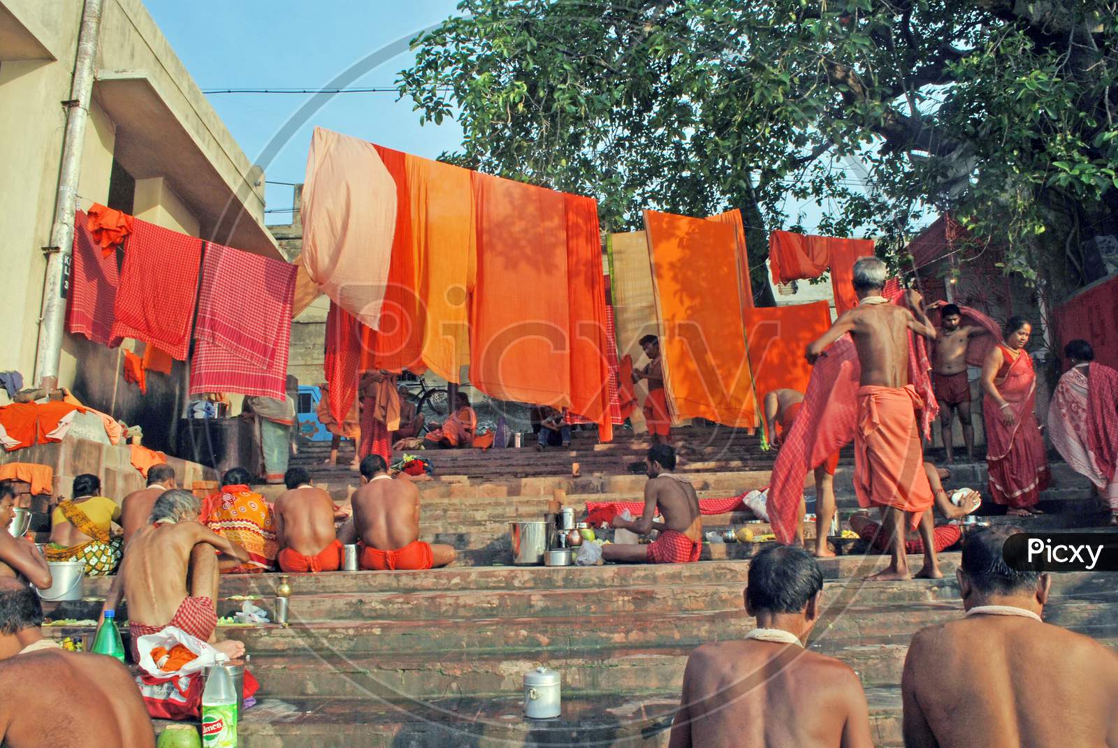 gajon devotees sitting at ganga ghat kolkata west bengal india