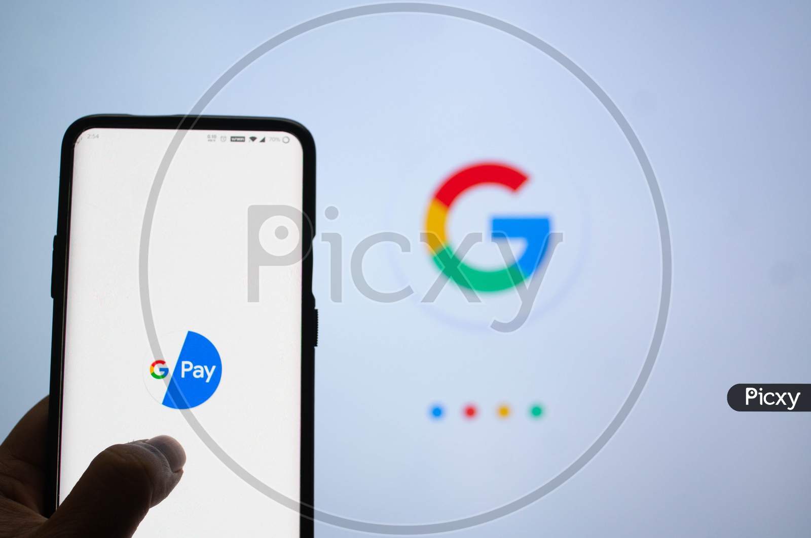 Google Pay App Logged In On A Mobile Infront Of A White Screen With Google Symbol