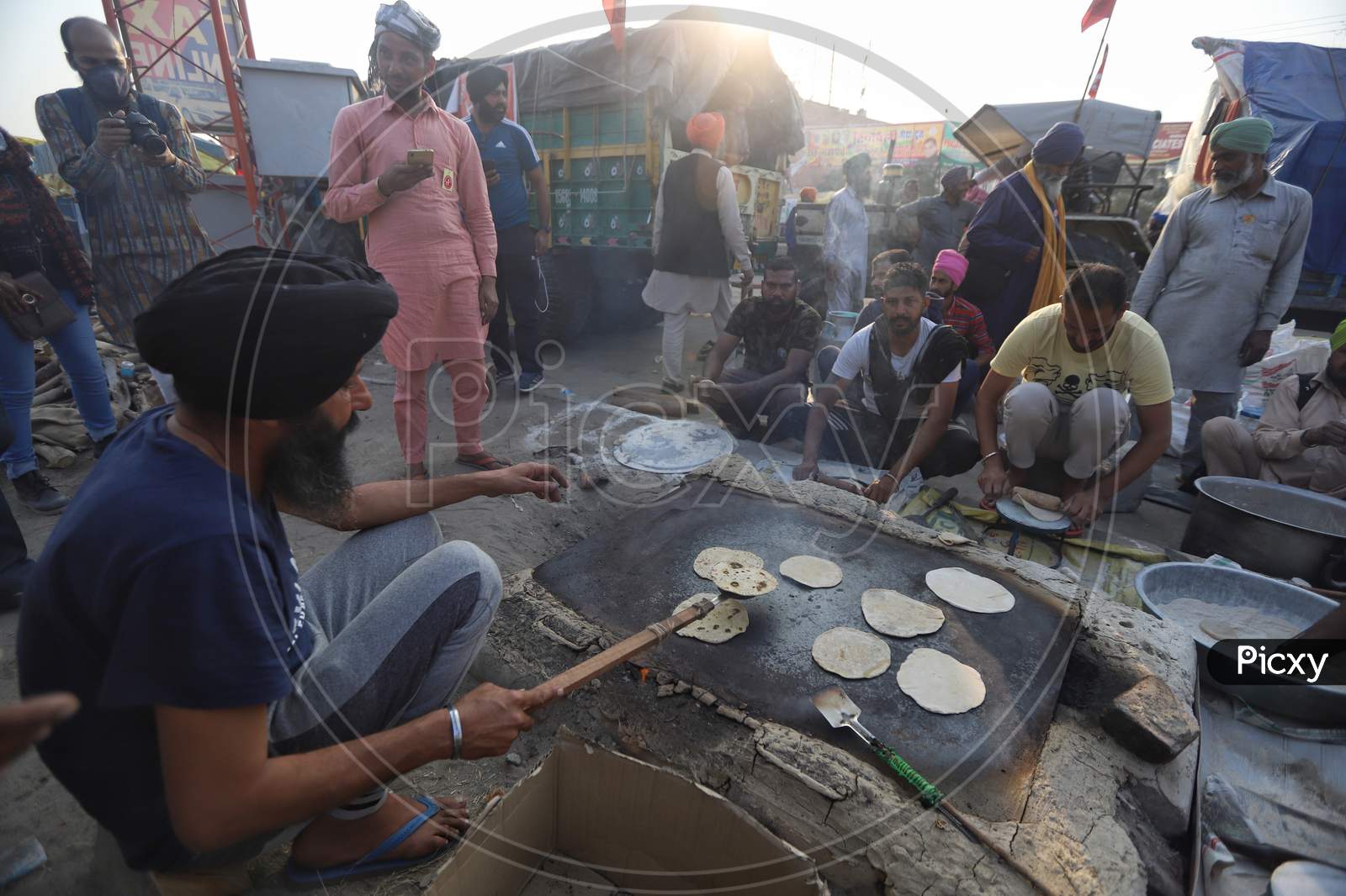 Farmers preparing food at Singhu Border during a protest against new farm laws in New Delhi, India.