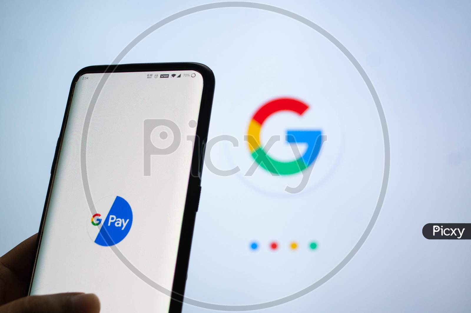 Google Pay App Logged In On A Mobile Infront Of A White Screen With Google Symbol