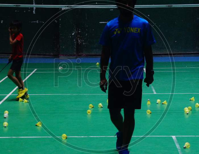 Badminton Coach coming out of court after completion of training session