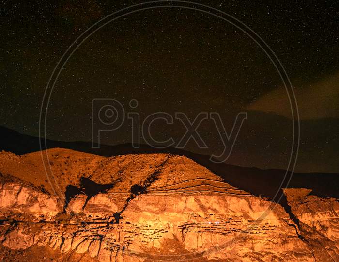 Cave City In Vardzia At Night With Starry Night And No Person. Blank Space Background. Stunning Dramatic Placesto Visit At Night.