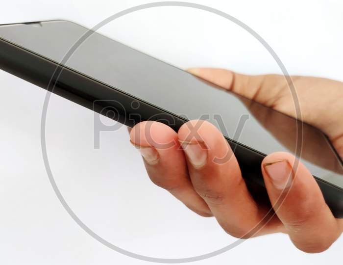 Hand Holding Black Smart Phone Isolated On A White Background.Concept For Business And Technology.