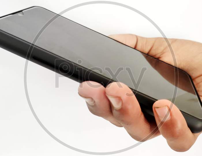 Hand Holding Black Smart Phone Isolated On A White Background.Concept For Business And Technology.