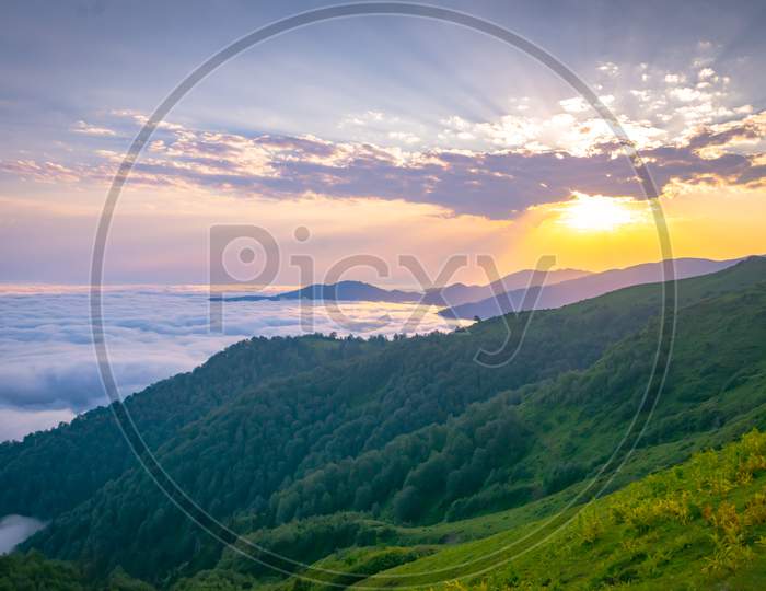 Stunning Sunset Above The Horizon And Clouds Above Georgia Gomismta Mount