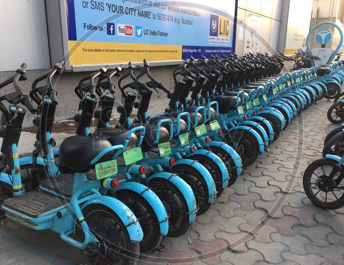 Image of Electric Scooters For Public Share Standing Outside In central ...