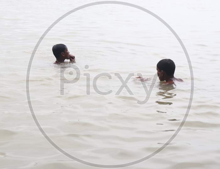 kids playing in Ganga river