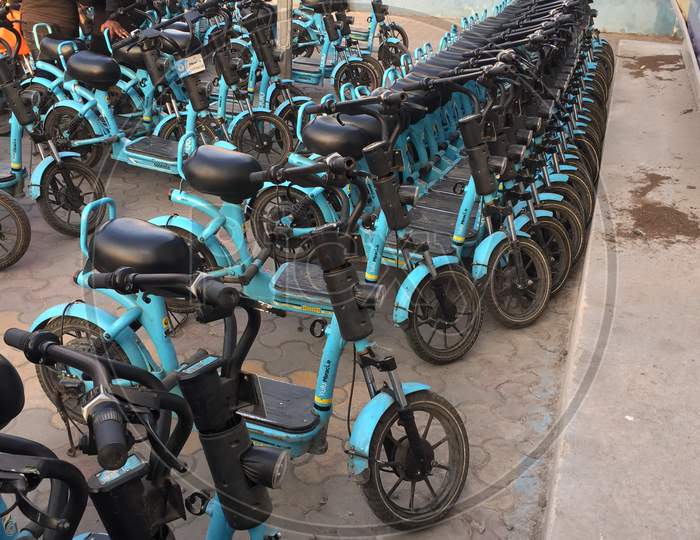 Image of Electric Scooters For Public Share Standing Outside In central ...