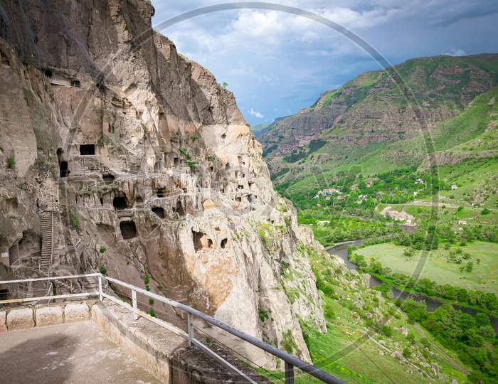 Panoramic Viewpoint Of Vardzia City Caves With Green Canyon In Background
