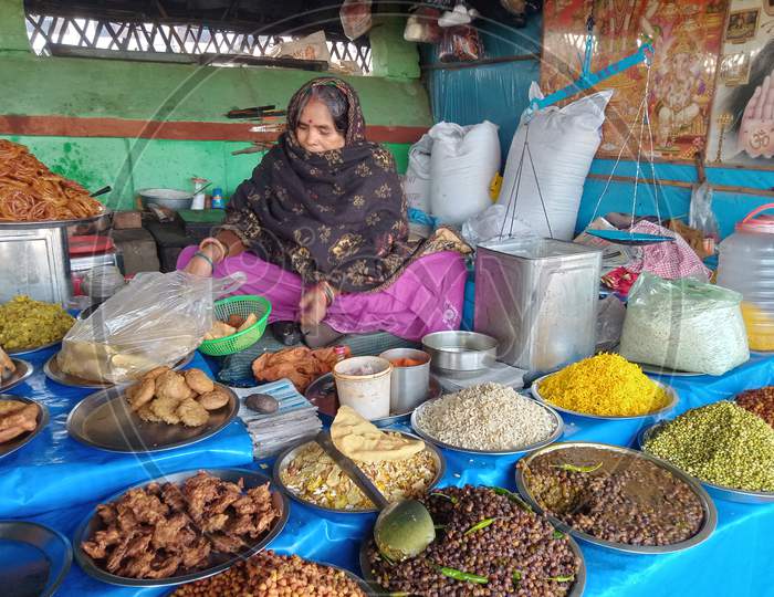 Old Jhalmudi shop in India , Indian shop , Old women