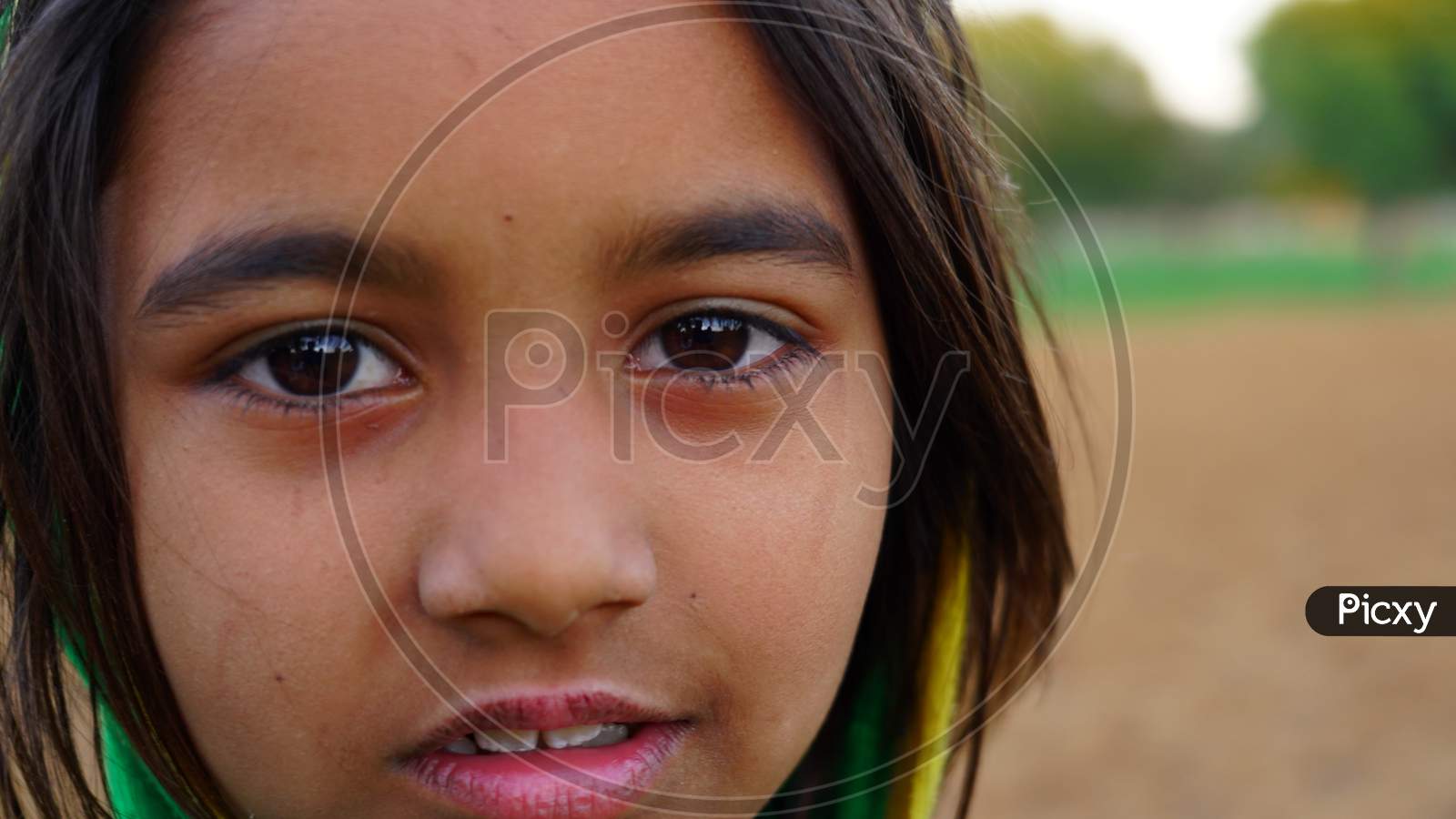 Image of Cute Short Haired Little Girl View Seeing At The Camera. Little Innocent  Girl In Blue Colored Dress With Smiling Face.-LU811364-Picxy